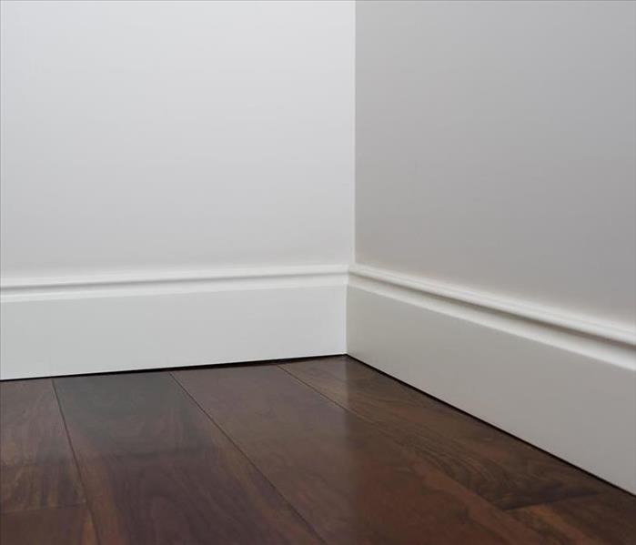 white baseboards along the floor 