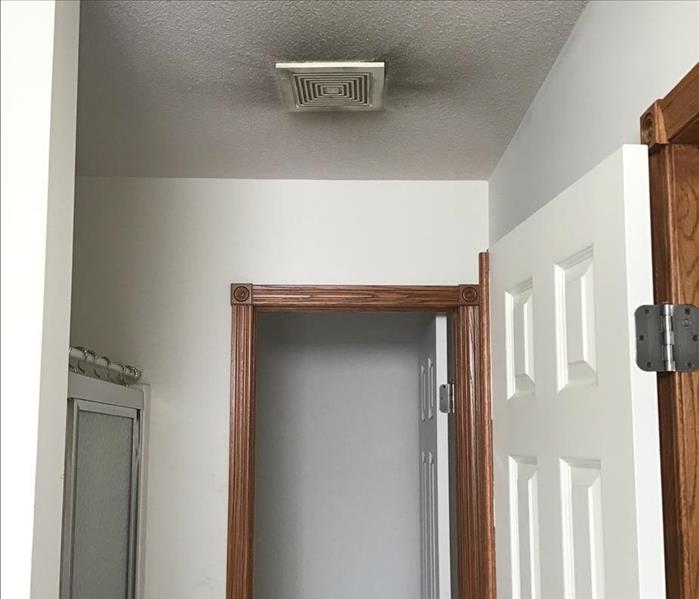 Visible soot around the bathroom exhaust fan